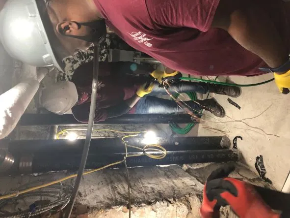 PLatinum Electricians working around Cast iron pipe