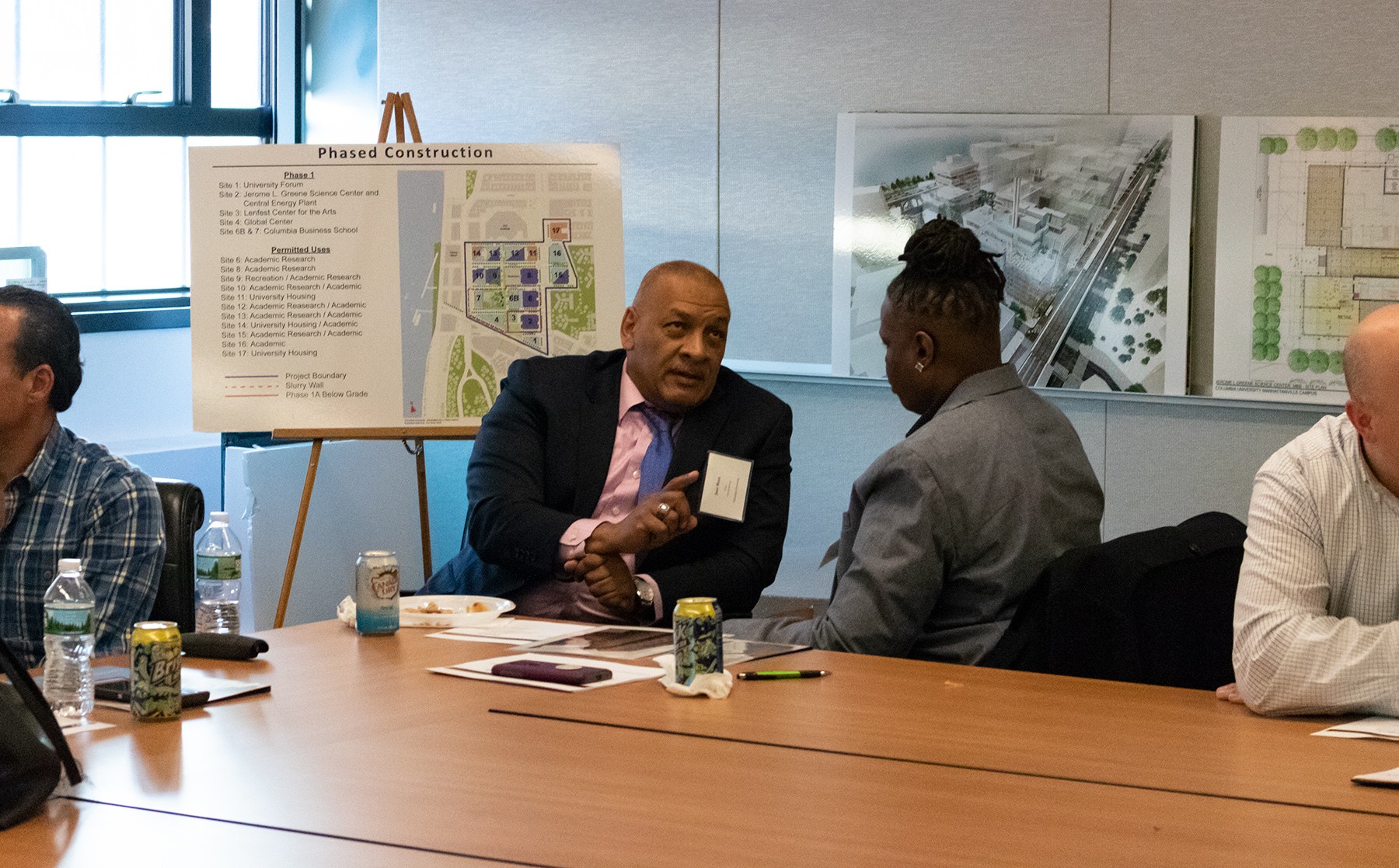 José Rosa, Director of Operations for Residential and Commercial Services, left, coaches Simone Peele, Principal at A New World Contracting Co.  Individualized coaching helps each participant focus on growth areas that will expand their company’s capability that can propel them toward being awarded contracts and earning more revenue.