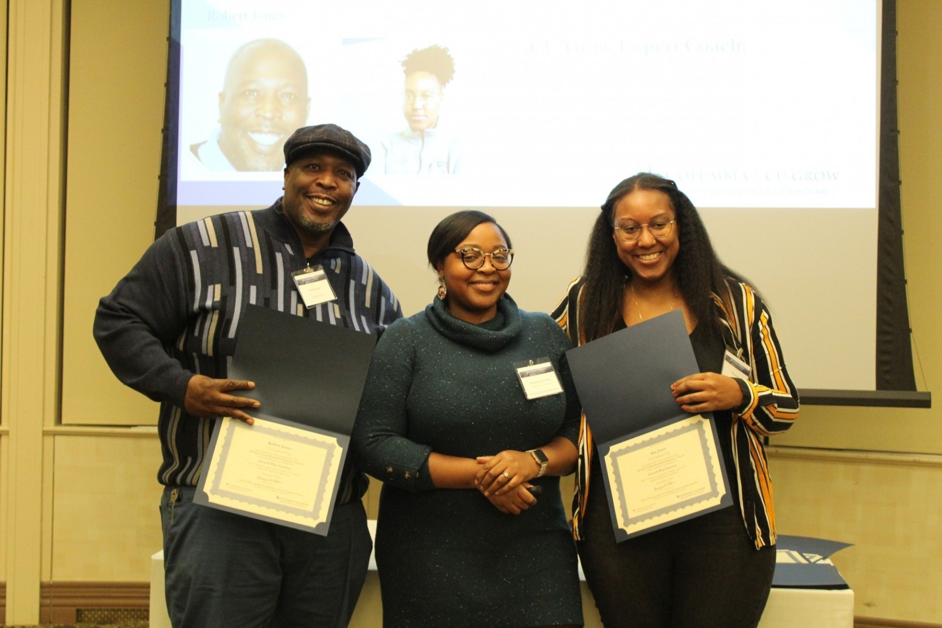 Father and daughter, Robert and Aija Jones from F.I. Electrical were among the graduates of the CU Grows sixth cohort. CU Grow firm Father and daughter collecting certificate